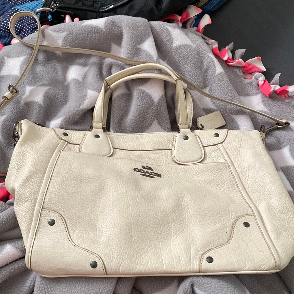 Cream crossbody Coach bag